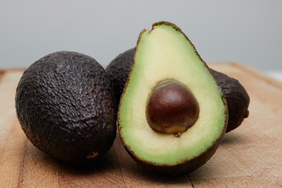 How long does it take for the Hass avocado in my home to bear fruit?